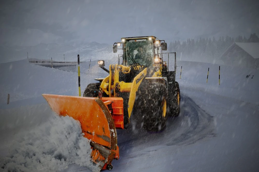 Commercial snow clearing service plowing snow 5 Ways Snow Removal Services Help Companies Improve Customer Experience