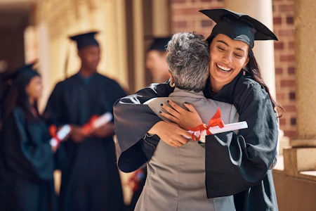 Parent and student at graduation Better Events Happen with Better Event Planning Support